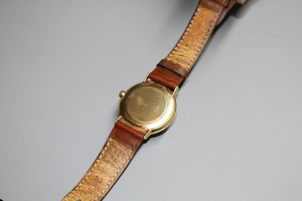 A gentlemans Omega manual wind wrist watch, on associated strap,